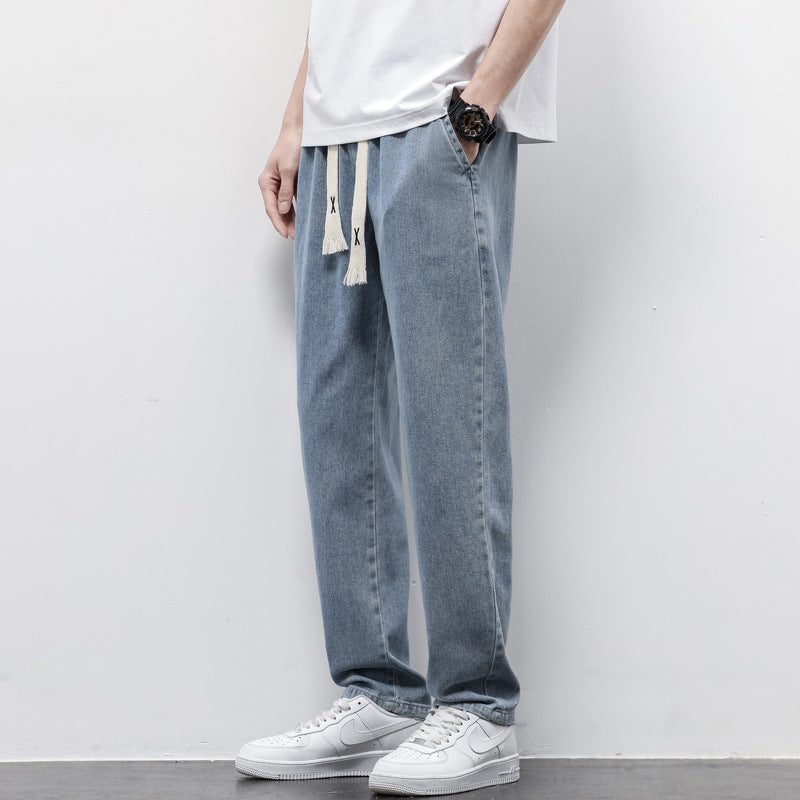 Summer Loose Wide Leg Jeans Pants for Men with Drawstring Waist styled with a casual t-shirt and sneakers.