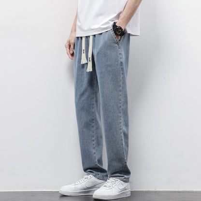 Summer Loose Wide Leg Jeans Pants for Men with Drawstring Waist styled with a casual t-shirt and sneakers.