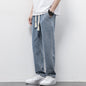 Summer Loose Wide Leg Jeans Pants for Men with Drawstring Waist styled with a casual t-shirt and sneakers.