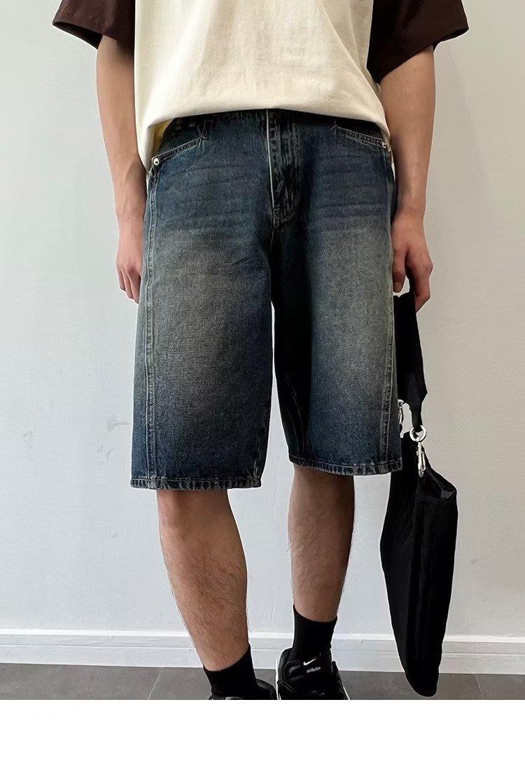 Model wearing washed loose straight denim shorts in a relaxed skater style from Novien Apparel