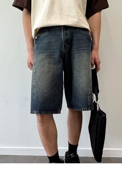 Model wearing washed loose straight denim shorts in a relaxed skater style from Novien Apparel
