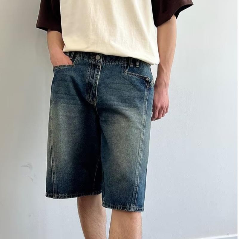 Model wearing washed loose straight denim shorts in a relaxed skater style from Novien Apparel