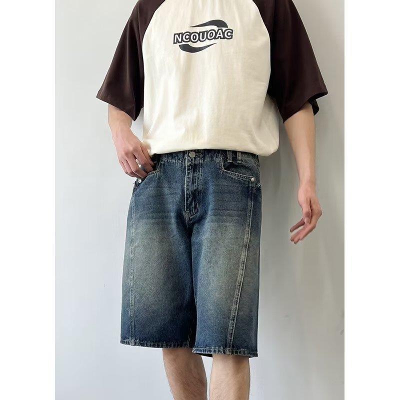 Model wearing washed loose straight denim shorts in a relaxed skater style from Novien Apparel