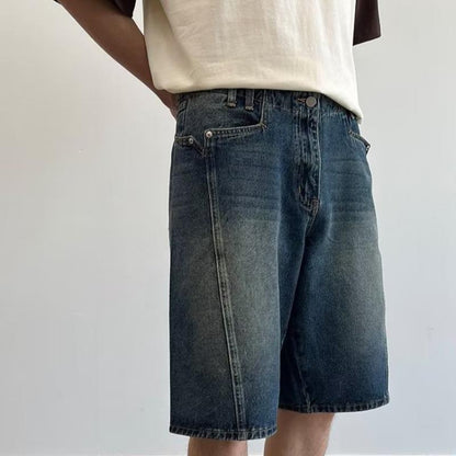 Model wearing washed loose straight denim shorts in a relaxed skater style from Novien Apparel