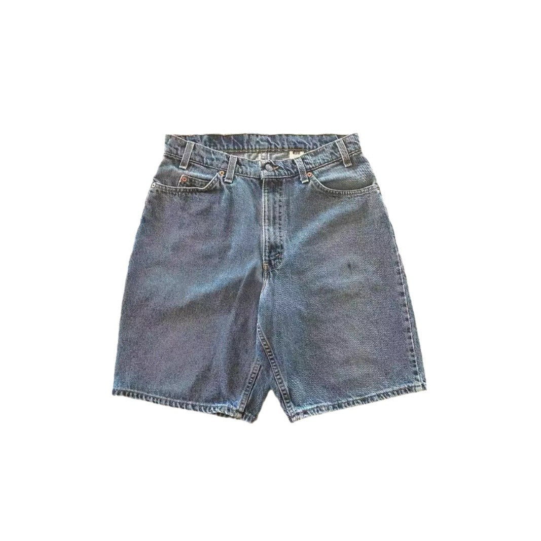 Distressed Y2K denim jeans showcasing a loose fit design, embodying vintage style and modern streetwear.