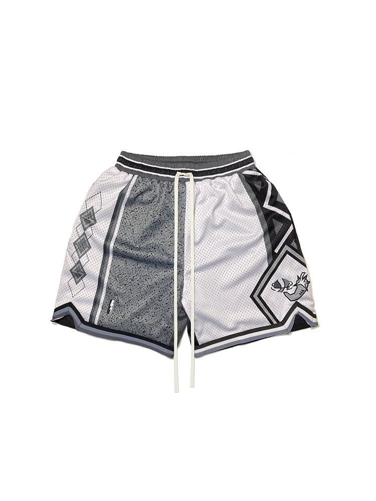 Model wearing printed mesh casual shorts in a relaxed streetwear style from Novien Apparel