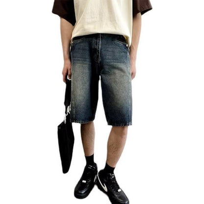 Model wearing washed loose straight denim shorts in a relaxed skater style from Novien Apparel